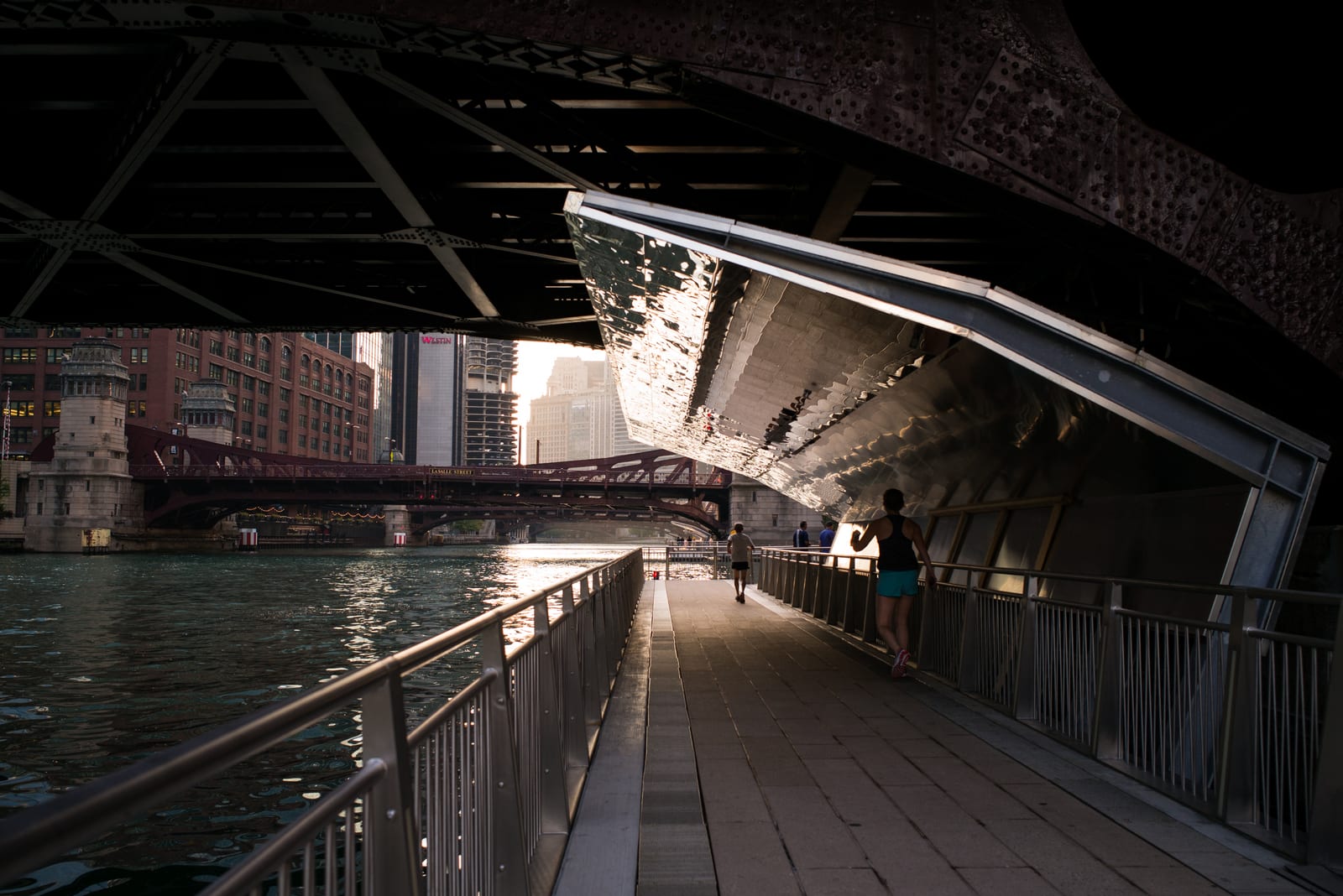 The Chicago Riverwalk along the Chicago River lined with downtown skyscrapers
