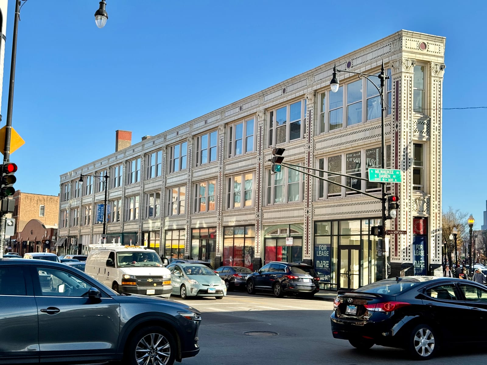 The triangular Flatiron Arts Building at the Milwaukee, North, and Damen six corners in Wicker Park